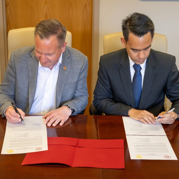 Two sign contracts